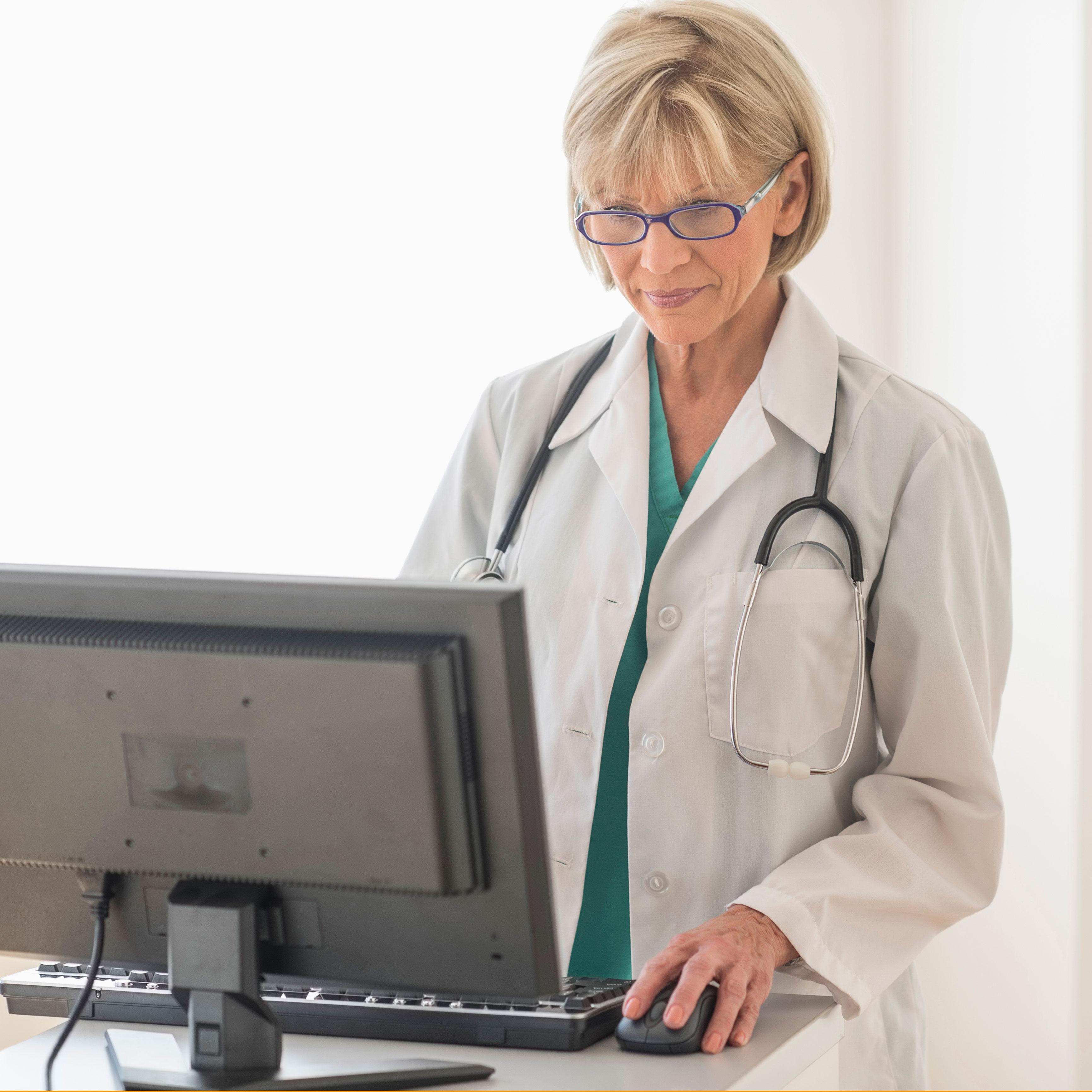 Image of a female clinician using a computer in a clinic