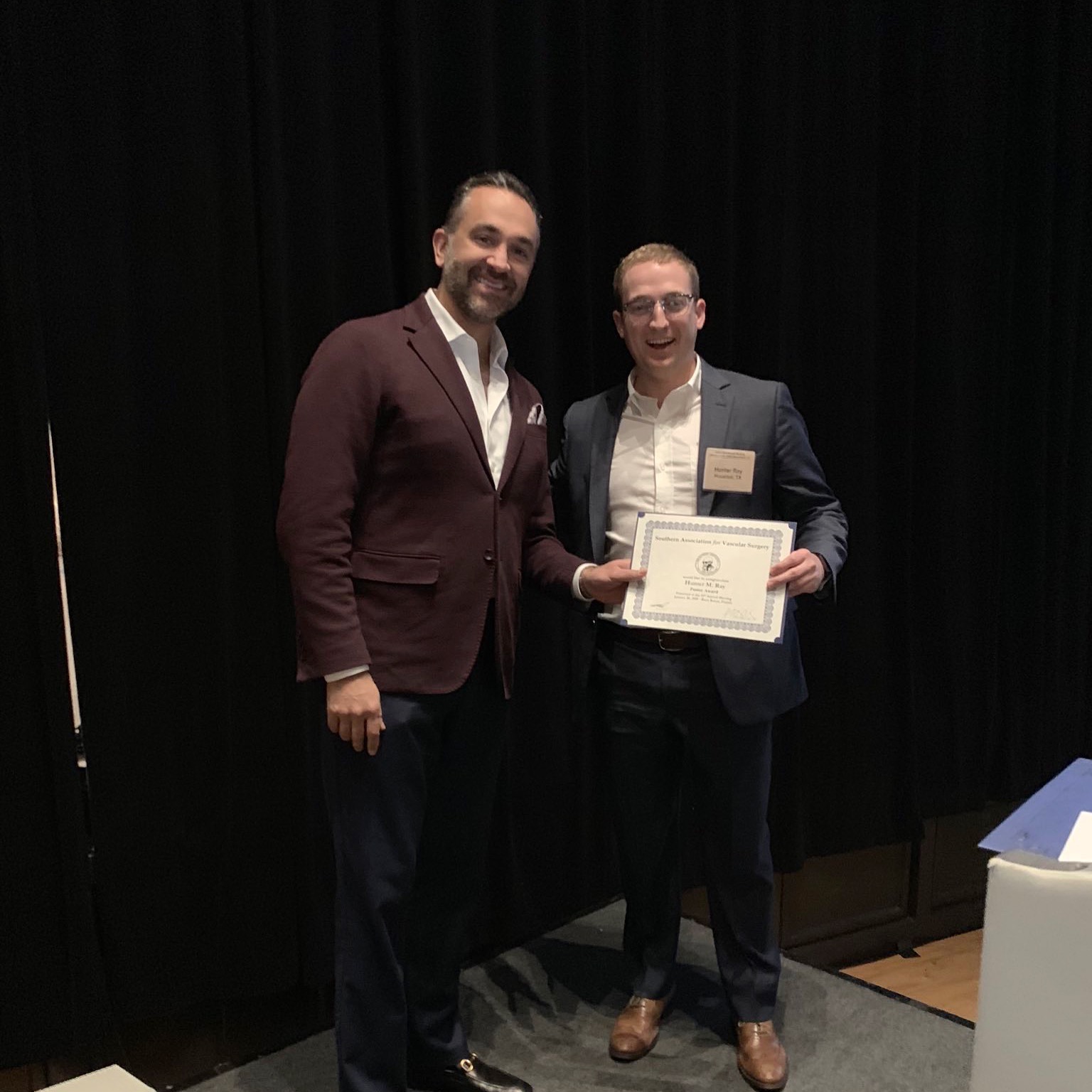 Dr. Ali Azizzadeh (right) with first place poster award winner Dr. Hunter Ray (left) at the 43rd Annual SAVS Meeting